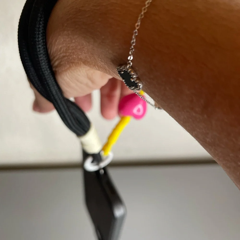 Black Phone Wrist Lanyard with Neon Accents and Pink Heart Bead